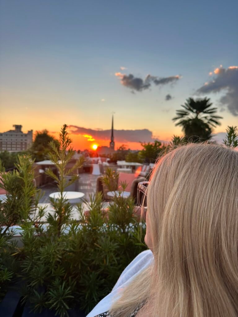 Sunset over Charleston rooftops from the Citrus Club at The Dewberry